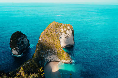 High angle view of rock in sea