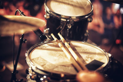 Cropped hand of man playing drum