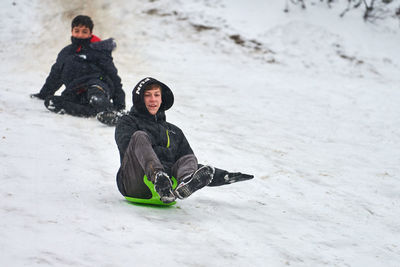 Portrait of siblings in snow