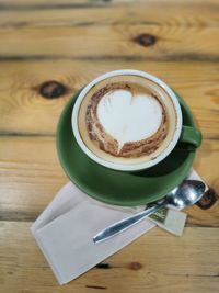 Close-up of cappuccino on table
