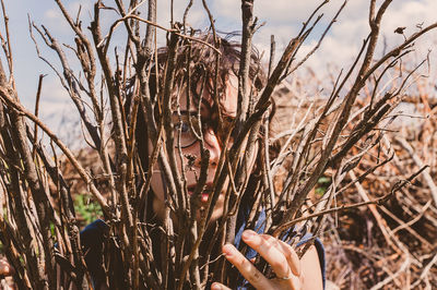 A portrait of a girl in thick branches