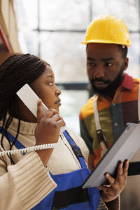 Portrait of young man using mobile phone