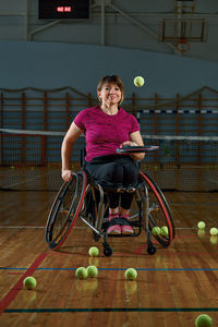 Portrait of boy playing tennis