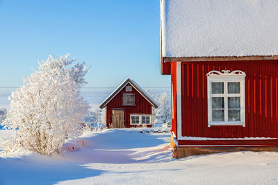 Red cottage in an idyllic winter landscape