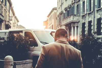 Rear view of man sitting in bus