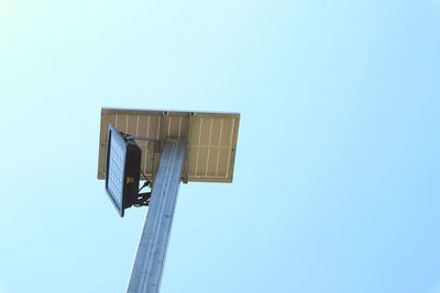 Low angle view of built structure against clear blue sky