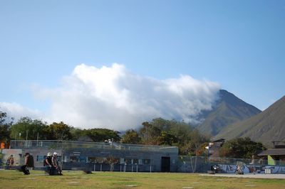 Scenic view of mountains against blue sky