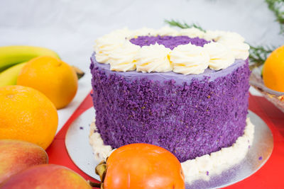 Close-up of cake and fruits on table during christmas