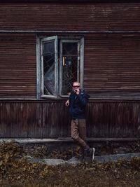 Man standing outside house