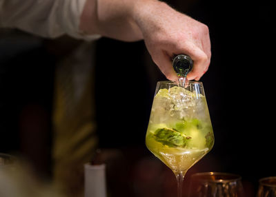 Close-up of hand holding glass of wine