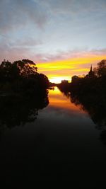 Scenic view of silhouette trees against sky during sunset