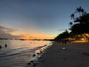 Scenic view of sea against sky at sunset