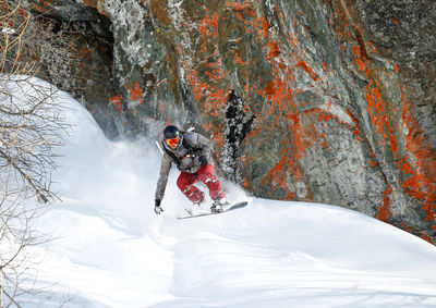 Man snowboarding on snow