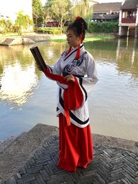 Young woman looking at lake