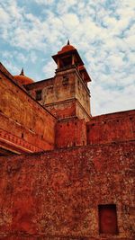 Low angle view of old building against sky