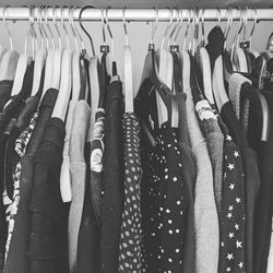 Close-up of clothes hanging on rack in store