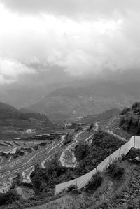 High angle view of mountain against cloudy sky