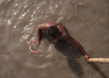 High angle view of man swimming in sea