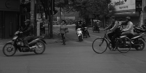 Bicycles parked on road in city