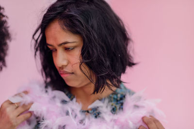 Close-up of young woman looking away