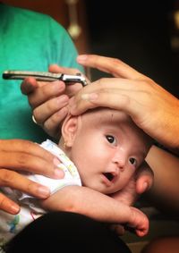 Midsection of woman holding baby