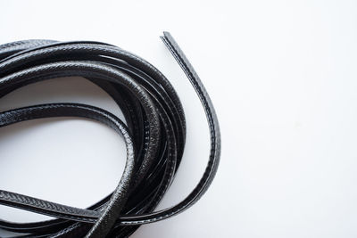 Close-up of camera on table against white background