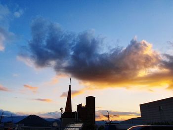 Low angle view of silhouette buildings against sky during sunset