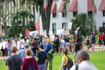 Group of people in front of buildings