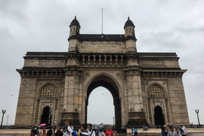 People in front of historical building