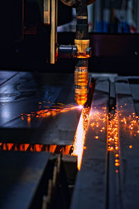 View of illuminated machinery in factory