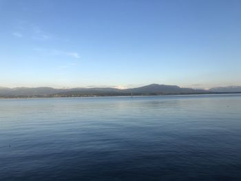 Scenic view of sea against clear blue sky