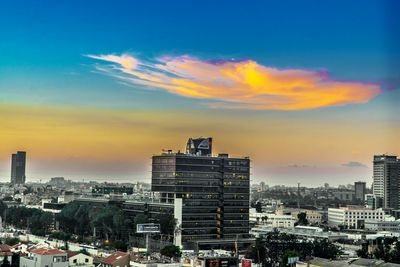 Cityscape against sky during sunset