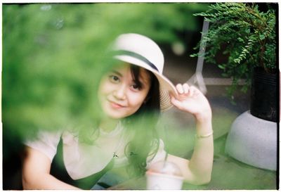 Portrait of woman sitting outdoors