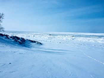Scenic view of sea against blue sky