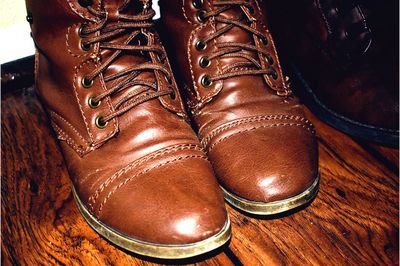 Low section of man wearing leather shoes