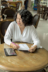 Woman sitting in restaurant