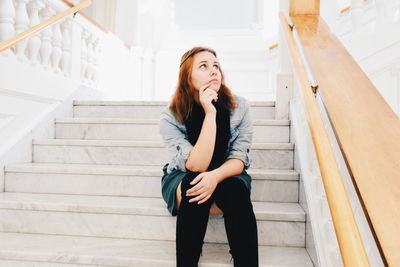 Woman sitting on steps