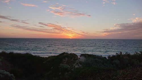 Scenic view of sea against sky during sunset