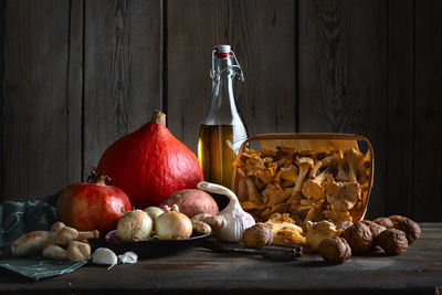 Various fruits in container on table