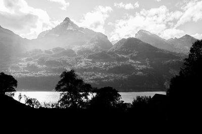 Scenic view of silhouette mountains against sky