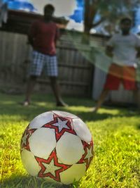 Close-up of soccer ball on field