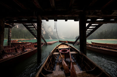 Boats moored at harbor