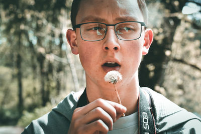 Close-up portrait of man wearing eyeglasses