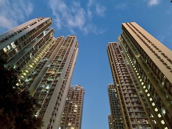 Low angle view of modern buildings against sky