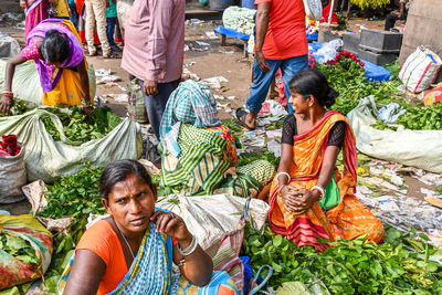 Group of people at market stall