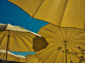 Low angle view of umbrella against sky