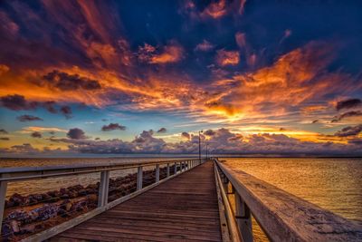 Scenic view of beach against sky during sunset