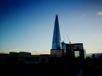 Low angle view of buildings against sky during sunset