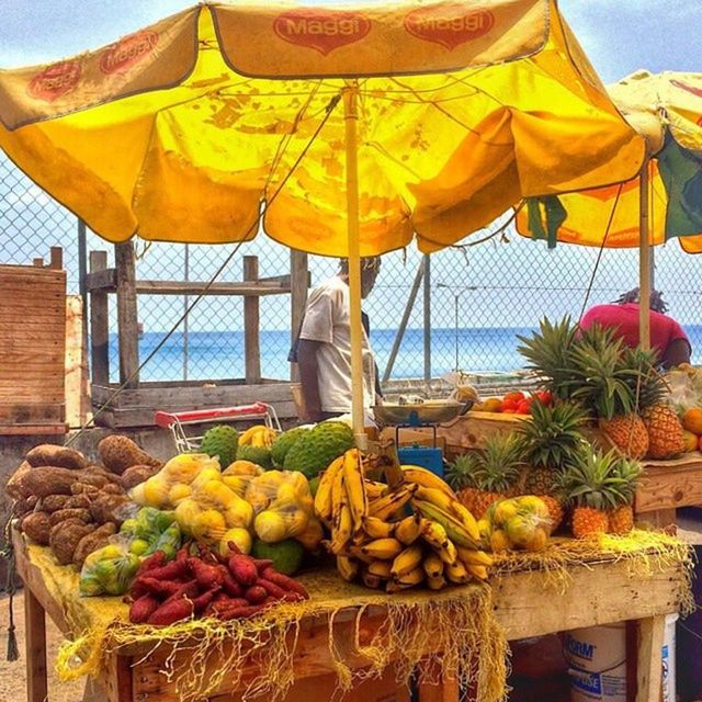 food and drink, food, fruit, yellow, abundance, healthy eating, freshness, market stall, variation, for sale, large group of objects, sky, market, hanging, retail, vegetable, basket, outdoors, day, pumpkin