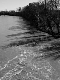 River amidst trees against sky